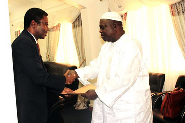 Dr. Sagoe-Moses in a brotherly gesture, warmly hands over his credentials to the Hon. Min. for Foreign affairs, Dr. Aboubacarr Senghore