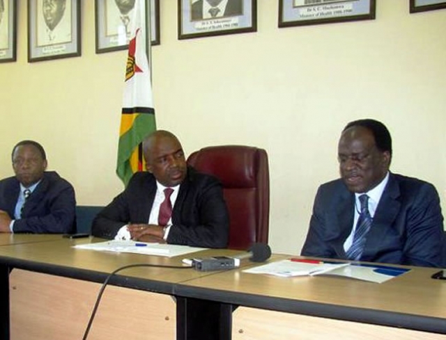 Deputy Minister Chimedza(c) following attentively while Dr David Okello presents his statement during the press conference