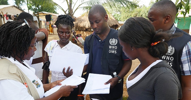 Ebola contact tracing team at work in the quarantined village, Bombali district, Sierra Leone.