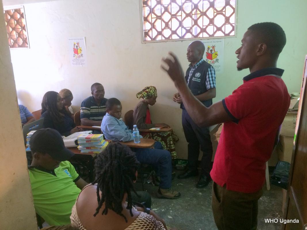 Refugees engage with WHO officials at the orientation meeting