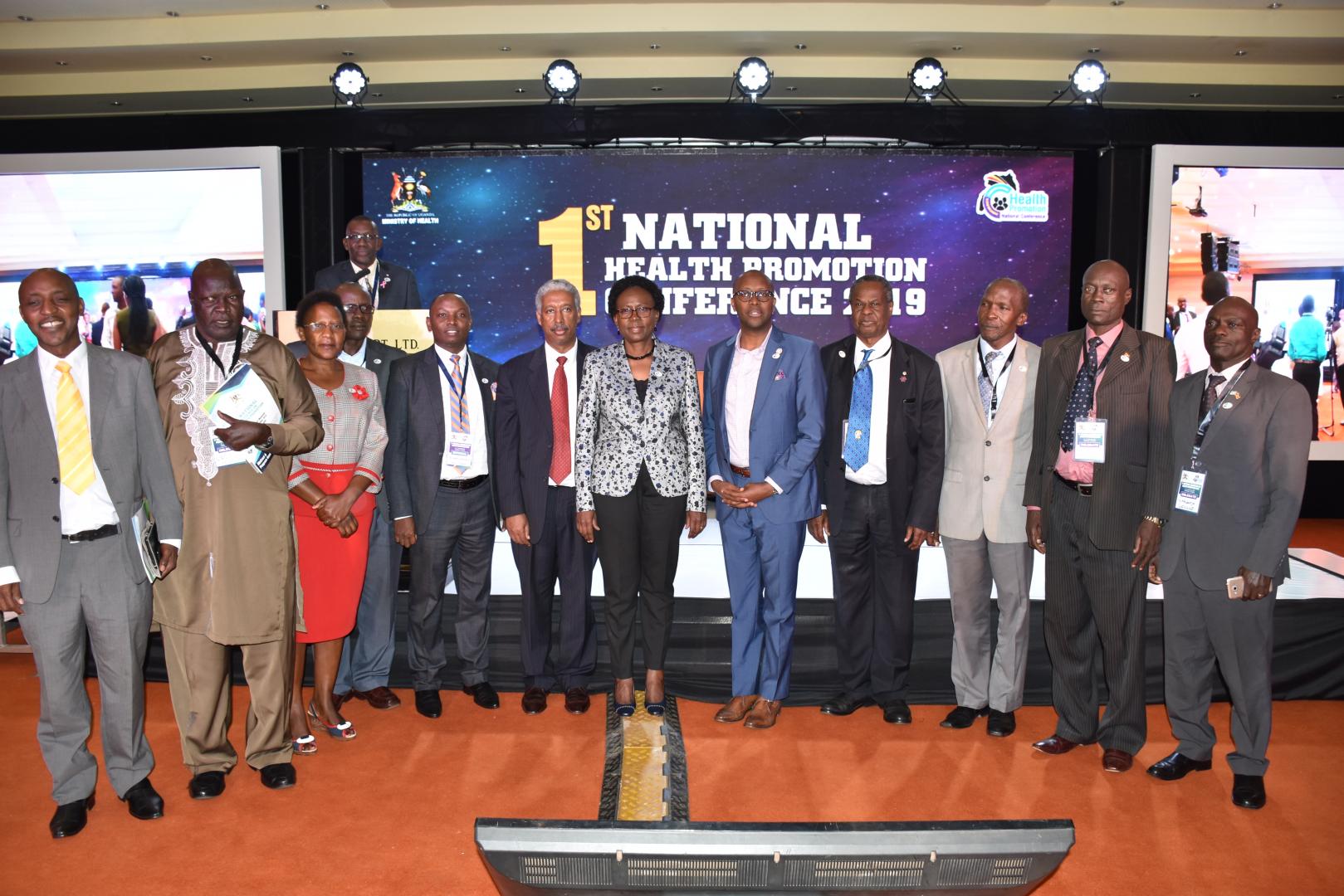 Minister of Health Dr Jane Ruth Aceng, WHO Representative to Uganda, Dr Yonas Tegegn Woldemariam and, Dr Githingi Gitahi, the Group Chief Executive Officer of Amref Health Africa with delegates at the Health Promotion Conference