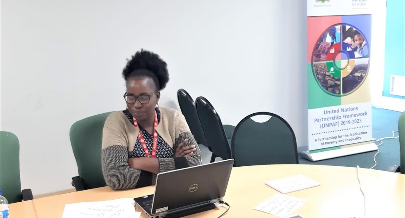 Ms Ndilimeke Mutikisha  proving online training to surveillance officers on COVID-19 