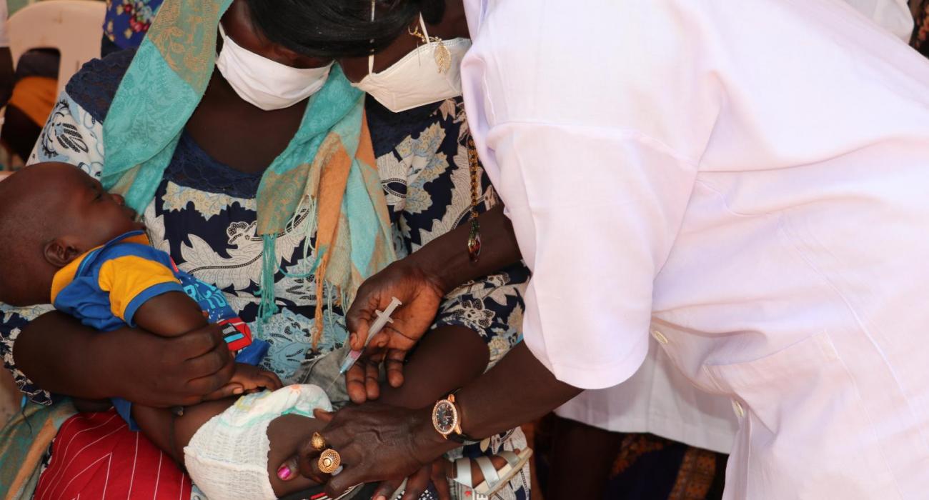 A health worker gives an injectable inactivated polio vaccine in Juba