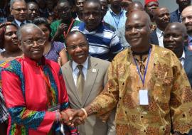 Shaking hands: NTDs Ambassador Evelyne Kandakai (in red) and Hon Johnson Toe Chea (right), Dr Francis Kateh (middle) 