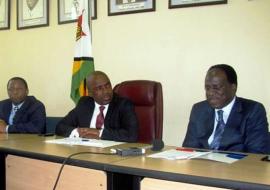 Deputy Minister Chimedza(c) following attentively while Dr David Okello presents his statement during the press conference