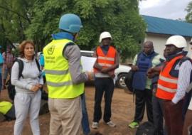 Mr Sylvain Paul Denarie briefing the WHO team on the arrangements for evacuations