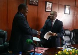 Dr. Jacob Mufunda, WHO Representative (left ) and Mr. Damoni Kitabire, Resident Representative, African Development Bank at the signing ceremony