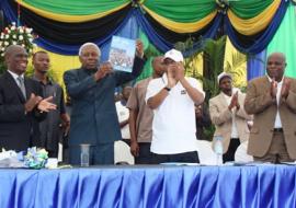 The Vice President holding the report launched during WMD 2012. Hon Minister at extreme left and WR at extreme right