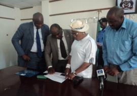 Deputy Governor of Osun State, reviewing the list of LGAs with un-immunized children with Dr Famiyesin WHO SW Zonal Coordinator, PS MOH and Mr Charles Korir.