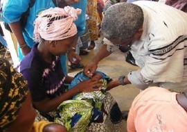 Deputy Minister administering the vaccine