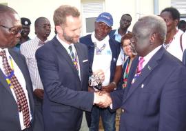 His Excellency Ambassador Alan Hamson hands the bunch of keys for the maternity complexes to the Honorable Minister Dr Riek Gai Kok. Photo WHO 