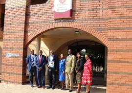 The WHO and the UB Teams after the ceremony, with the Vice Chancellor holding a document