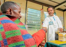 A health worker gives medication to a patient.  Kenya has embarked on a extensive evidence-based approach to root out TB 