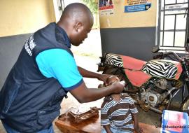 WHO staff administers Polio Vaccine during the OPV campaign in Uganda