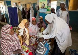 Trained health workers attending patients at a health facility