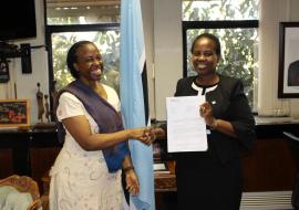 The Honourable Minister of International Affairs and Cooperation, Dr Unity Dow (right), receiving the credentials of the WHO Representative to Botswana, Dr Josephine Namboze (left)