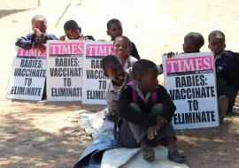 Children holding messages on rabies