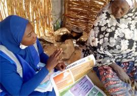 WHO personnel in Borno sensitizing a community member_Credit Chima Onuekwe_WHO