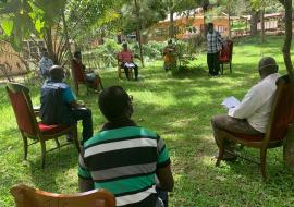 WHO official conducts community engagement in one of the communities in Masaka district