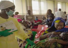 Mrs Sharia, a health worker counseling mother on breastfeeding practices