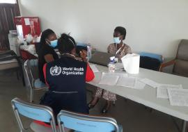 WHO staff and COVID-19 data management team at Prampram and Ablekuma Central verify mapping contacts to cases and checking for completeness of COVID-19 data.