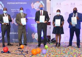 From left - Hon. Dikoloti (Min of MoHW), Mr Ebineng (Perm Sec of MoHW), Ambassador Cloud (USA), Dr Bataringaya (WHO HSS Advisor), Mr Morapedi (Dep. Perm Sec of Min of Local Gvt and Rural Dev) at launch of ICBHS guideline