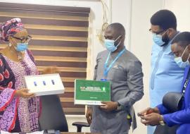 Dr Kofi Boateng alongside Dr Sunny Okoroafor handing over the NHWR soft document to Dr Azodoh at the FMoH_1.jpg