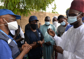 WR with a traditional leader in Borno State discussing community engagement for COVID-19 response.png 