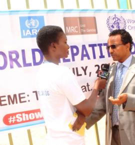 Dr. Desta A. Tiruneh being interviewed by QTV at the start of the commemoration of World Hepatitis Day 2018delivering a statement.