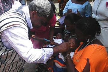 01 The Minister administering first dose of the vaccine