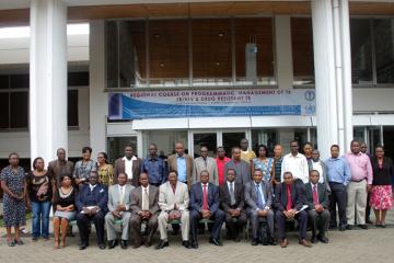 The Permanent Secretary Mr. Mark Bor CBS 6th from left poses for a photograph with the Director of KEMRI Dr S. Mpoke 5th from left, WHO OIC Dr R. Mpazanje, facilitators