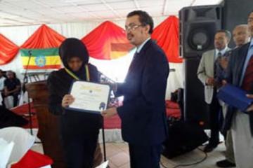 His Execllency Dr. Tedros Adhanom, Minister of Health - Ethiopia awarding H.E. W/ro Azeb Mesfin, at the World Mental Health Day event, Addis Ababa