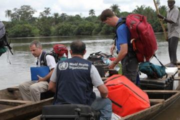 WHO mobile lab scientists at the crossing point between Guinea and Sierra Leone. WHO/Saffea Gborie