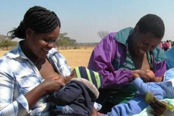 Some of the mothers who attended the launch breastfeeding and bonding with their babies