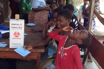 A young child taking in the Oral Cholera Vaccine during the first dose campaign in Chikwawa