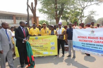 Minister of Health, Hon. Chitalu Chilufya flagging off the march at the launch of the national MR vaccination campaign in Lusaka.