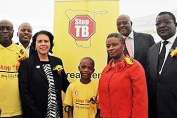 WHO Representative, Dr Magda Robalo, US Ambassador Ms Wanda Nesbit, Khomas Regional Governor, Mr Samuel Nuuyoma, Permanent Secretary, Ministry of Health and Social Services Mr Kahuure, Khomas Regional Director Mr Taapopi at the World TB commemoration pose with 12 years old TB patient, Petrus Dumeni who was diagnosed and successfully completed TB treatment