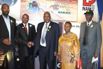 From left to right: CEO of the MVA, Jerry Mr Jerry Muadinhohamba, CEO of Nampost, Mr Festus Hangula, Honourable Minister of Works and Transport, Mr ErkkiNghimtina, WHO Representative, Dr Magda Robalo and NRSC, Executive Secretary, Eugene Tendekule, unveil the commemorative stamp to mark the Global Decade of Action for Road Safety.