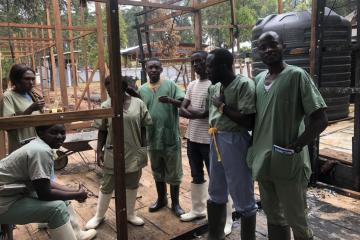 Psychologist team at the Butembo Ebola Treatment Centre meet in their office which was damaged in an arson attack earlier this year.
