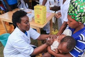 The Minister of Health, Dr Diane Gashumba, providing Measles and Rubella Vaccine