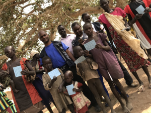 Dr Wamala in a group photo with the vaccinated community members