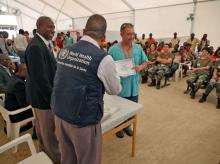 Cuban health care workers received their certificates from the Cuban ambassador to Liberia.