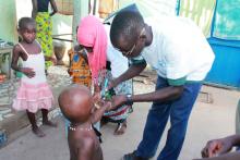 House marking to ensure all hoMarking the finger of a vaccinated child with indelible ink to avoid double dosage during the campaignmes are visited and all eligible children vaccinated