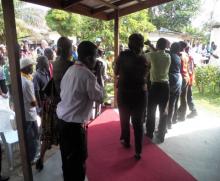 President Sirleaf and entourage entered the Christ Kingdom Harvest Church, where the program was held. At the far end, the President was washing her hands in 0,05% chlorine solution. 