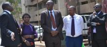 Dr Joel Gondi, MOH, speaks with colleagues during the handing over of 15 donated ambulances by WHO to six counties.  They are from left, Dr Joyce Lavussa, WHO,  Dr Patrick Amoth, MOH, Dr Martin Chabi, WHO and  Dr Dalmas  Oyugi, Migori County