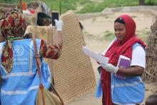 Field Volunteers taking a geo-coordinate of a reported case of cholera in Sector 4, Muna IDPs camp. Photocredit: WHO/CE.Onuekwe.