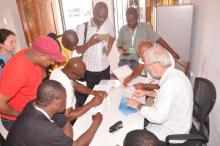 Participants learning snail identification in the laboratory