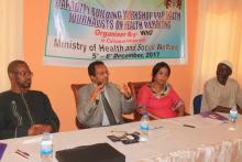 L-R PS. Barry, WHO Rep., Mrs. Isha Davies and HPR at the High Table  