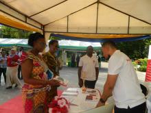 WHO staff visiting the exhibition booths during the launch