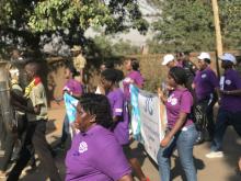 Participants match on during the cancer day commemoration 